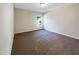 Bright bedroom with carpeted floor and window at 9 Oxmoor Dr, Durham, NC 27703