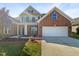 Brick home with two-car garage and landscaping at 9 Oxmoor Dr, Durham, NC 27703