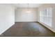 Formal dining room with chandelier and large window at 9 Oxmoor Dr, Durham, NC 27703