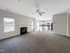 Spacious living room with fireplace and view into kitchen at 9 Oxmoor Dr, Durham, NC 27703