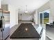 Kitchen boasts granite island and stainless steel appliances at 9 Oxmoor Dr, Durham, NC 27703