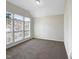 Bright bedroom featuring three windows with blinds at 9 Oxmoor Dr, Durham, NC 27703