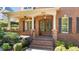 Double wood doors and brick columns leading to the front entrance at 206 Felspar Way, Cary, NC 27518