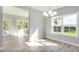 Bright dining room with hardwood floors and access to a sunroom at 167 Pretty Run Branch Ln, Wendell, NC 27591