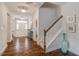 Elegant staircase with hardwood floors and white railing at 167 Pretty Run Branch Ln, Wendell, NC 27591