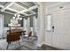 Home office with coffered ceiling, hardwood floors, and built-in shelving at 167 Pretty Run Branch Ln, Wendell, NC 27591