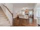 Open living room with hardwood floors and fireplace at 167 Pretty Run Branch Ln, Wendell, NC 27591