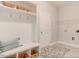 Laundry room with built-in shelving and a bench at 167 Pretty Run Branch Ln, Wendell, NC 27591