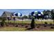 Community pool with multiple umbrellas at 167 Pretty Run Branch Ln, Wendell, NC 27591