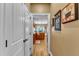 View of kitchen from hallway with hardwood floors and wood cabinets at 319 River Knoll Dr, Clayton, NC 27527