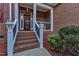 Brick front entry with steps, railing, and landscaping at 319 River Knoll Dr, Clayton, NC 27527