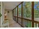 Screened porch with wooden flooring and access to the backyard at 319 River Knoll Dr, Clayton, NC 27527