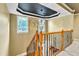 Elegant staircase with wrought iron railing and a chandelier at 319 River Knoll Dr, Clayton, NC 27527