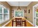 Bright breakfast nook with window seating and decorative table setting at 319 River Knoll Dr, Clayton, NC 27527