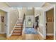 Two story entry with hardwood floors, staircase, and chandelier at 319 River Knoll Dr, Clayton, NC 27527