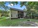 Two-story house back view, screened porch, deck, and firepit at 319 River Knoll Dr, Clayton, NC 27527