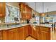 Kitchen features granite countertops, wood cabinets, and a breakfast bar at 319 River Knoll Dr, Clayton, NC 27527