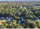 Aerial view of house showing its location in a quiet, wooded neighborhood at 319 River Knoll Dr, Clayton, NC 27527