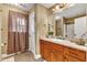Bathroom with wood cabinets and granite countertop at 319 River Knoll Dr, Clayton, NC 27527