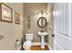 Small bathroom with pedestal sink and decorative wall art at 319 River Knoll Dr, Clayton, NC 27527