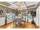 Elegant dining room boasts hardwood floors and a charming chandelier at 319 River Knoll Dr, Clayton, NC 27527