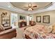 Primary bedroom with king bed and seating area near bathroom at 319 River Knoll Dr, Clayton, NC 27527