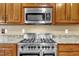 Stainless steel appliances and granite countertops highlight this kitchen at 319 River Knoll Dr, Clayton, NC 27527