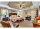 Primary bedroom with king bed and seating area at 319 River Knoll Dr, Clayton, NC 27527