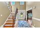 Two story entry with hardwood floors, staircase, and chandelier at 319 River Knoll Dr, Clayton, NC 27527