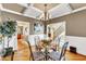 Spacious dining room with hardwood floors and a view of the kitchen at 319 River Knoll Dr, Clayton, NC 27527