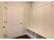 Convenient laundry area with built-in bench and storage at 169 Sage Ln # 012, Four Oaks, NC 27524