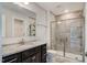 Bathroom boasts granite countertop, dark brown vanity, and a large shower at 169 Sage Ln # 012, Four Oaks, NC 27524