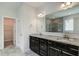 Double vanity bathroom with granite countertops and a large walk-in shower at 169 Sage Ln # 012, Four Oaks, NC 27524
