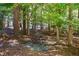 Small wooded sitting area with table and chairs at 675 Whitehurst, Pittsboro, NC 27312
