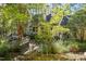 Landscaped backyard with stone path and bridge at 675 Whitehurst, Pittsboro, NC 27312