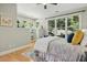 Main bedroom with built-in shelves and large windows at 675 Whitehurst, Pittsboro, NC 27312