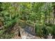 Wooden footbridge crosses a wooded area at 675 Whitehurst, Pittsboro, NC 27312