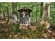 Rustic screened gazebo nestled amongst the trees at 675 Whitehurst, Pittsboro, NC 27312