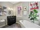 Spa-like bathroom with soaking tub and modern vanity at 675 Whitehurst, Pittsboro, NC 27312