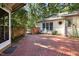 Brick patio with bench and small fountain at 675 Whitehurst, Pittsboro, NC 27312