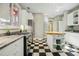 Bright kitchen with a butcher block island and checkerboard floors at 675 Whitehurst, Pittsboro, NC 27312