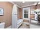 Bathroom boasts double vanity,granite countertops and clawfoot tub at 26 Oak St, Roxboro, NC 27573