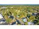 Aerial view showing home's location in a residential neighborhood with trees at 26 Oak St, Roxboro, NC 27573