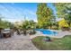Inviting kidney-shaped pool with patio and fire pit area at 26 Oak St, Roxboro, NC 27573