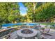 Expansive pool with fire pit and seating area at 26 Oak St, Roxboro, NC 27573
