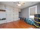 Large bedroom with hardwood floors and extensive built-in storage at 26 Oak St, Roxboro, NC 27573
