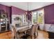 Elegant dining room with a chandelier and hardwood floors at 26 Oak St, Roxboro, NC 27573