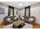 Living Room with hardwood floors, two sofas, and a coffee table at 26 Oak St, Roxboro, NC 27573