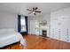 Spacious bedroom with hardwood floors, fireplace and built-in storage at 26 Oak St, Roxboro, NC 27573
