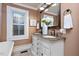 Elegant bathroom with double vanity and stained glass window at 26 Oak St, Roxboro, NC 27573